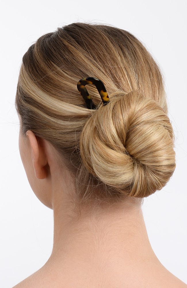 Long blonde hair in bun with Tokyo hair pin