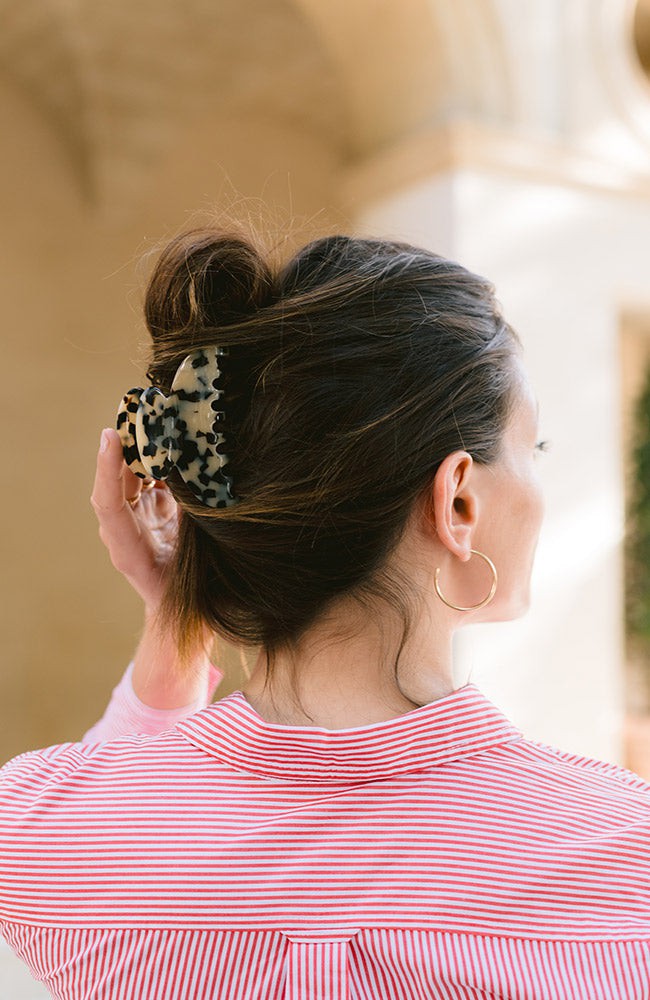 Woman with brown hair has her hair in a twist held with the Ivory Tokyo Couture Jaw by France Luxe